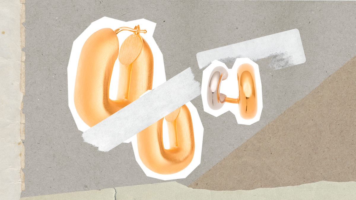 Gold hoop earrings summer style on textured background.