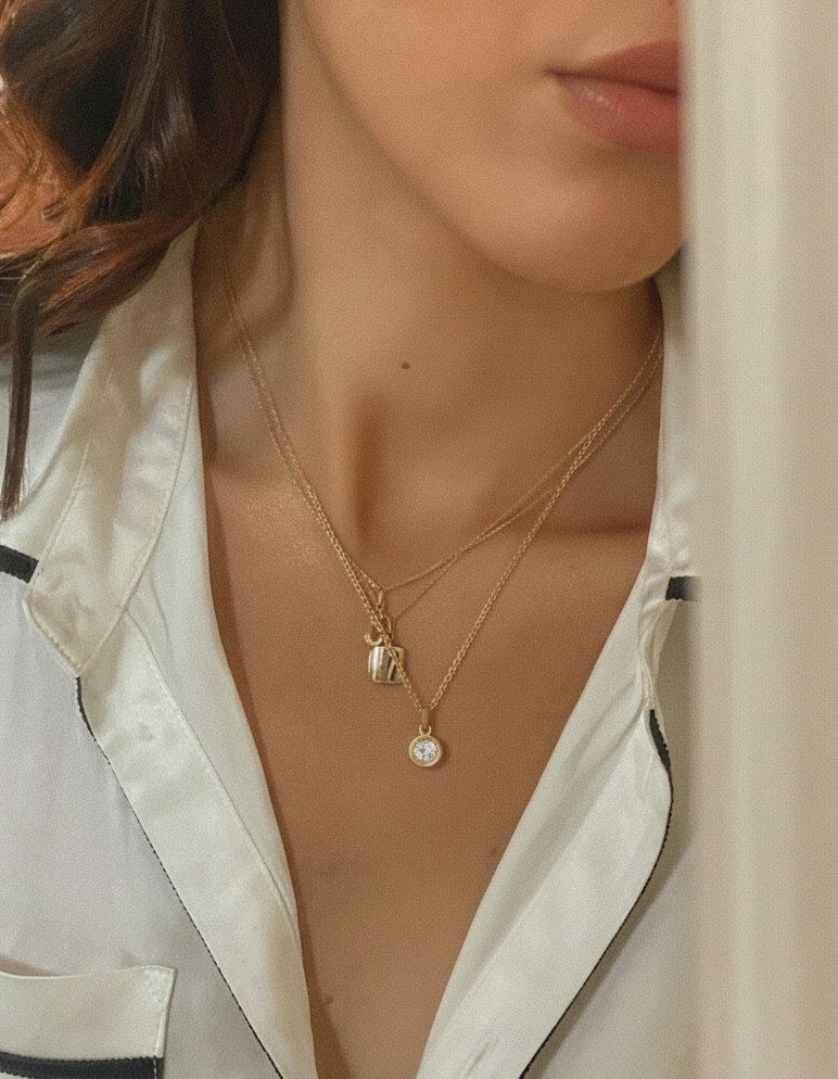 18k solid gold jewelry collection featuring layered necklaces with a diamond pendant and a lock charm