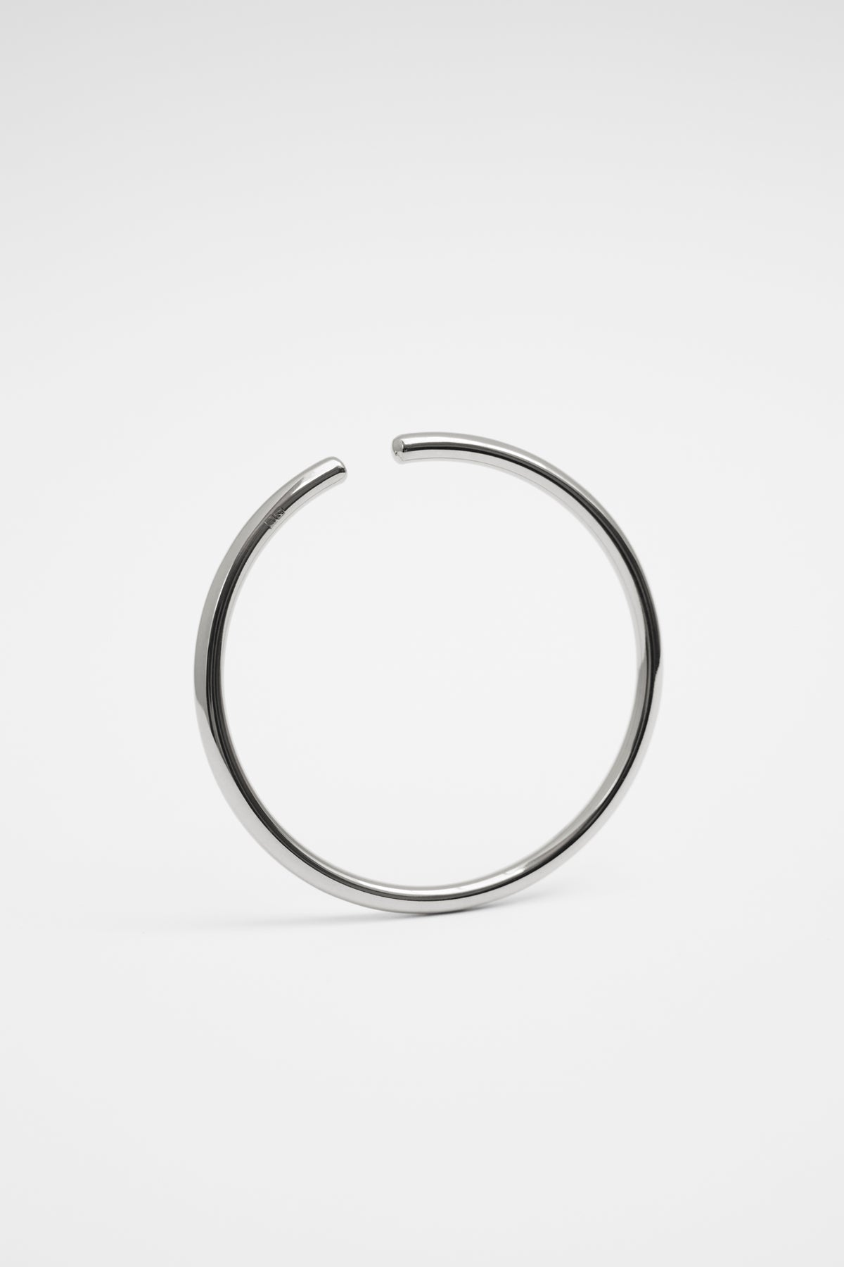 affordable handmade bracelets in a sleek, minimalist design, showcasing a modern open cuff style.