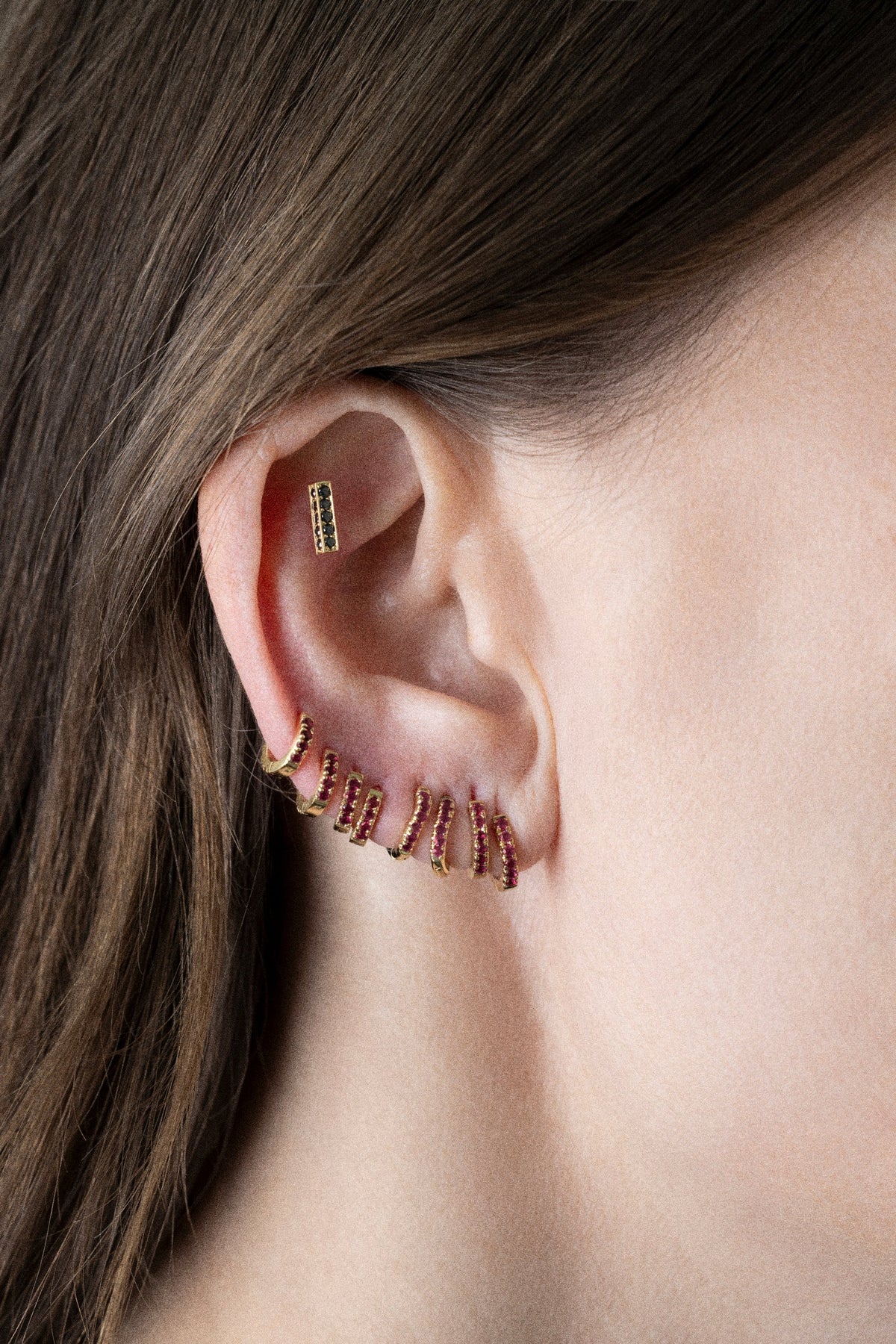 woman wearing earrings from CINCO super cool