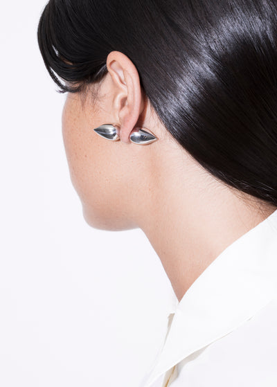gold plated vintage piercing showcased on an elegant model's ear, highlighting unique design and shine.