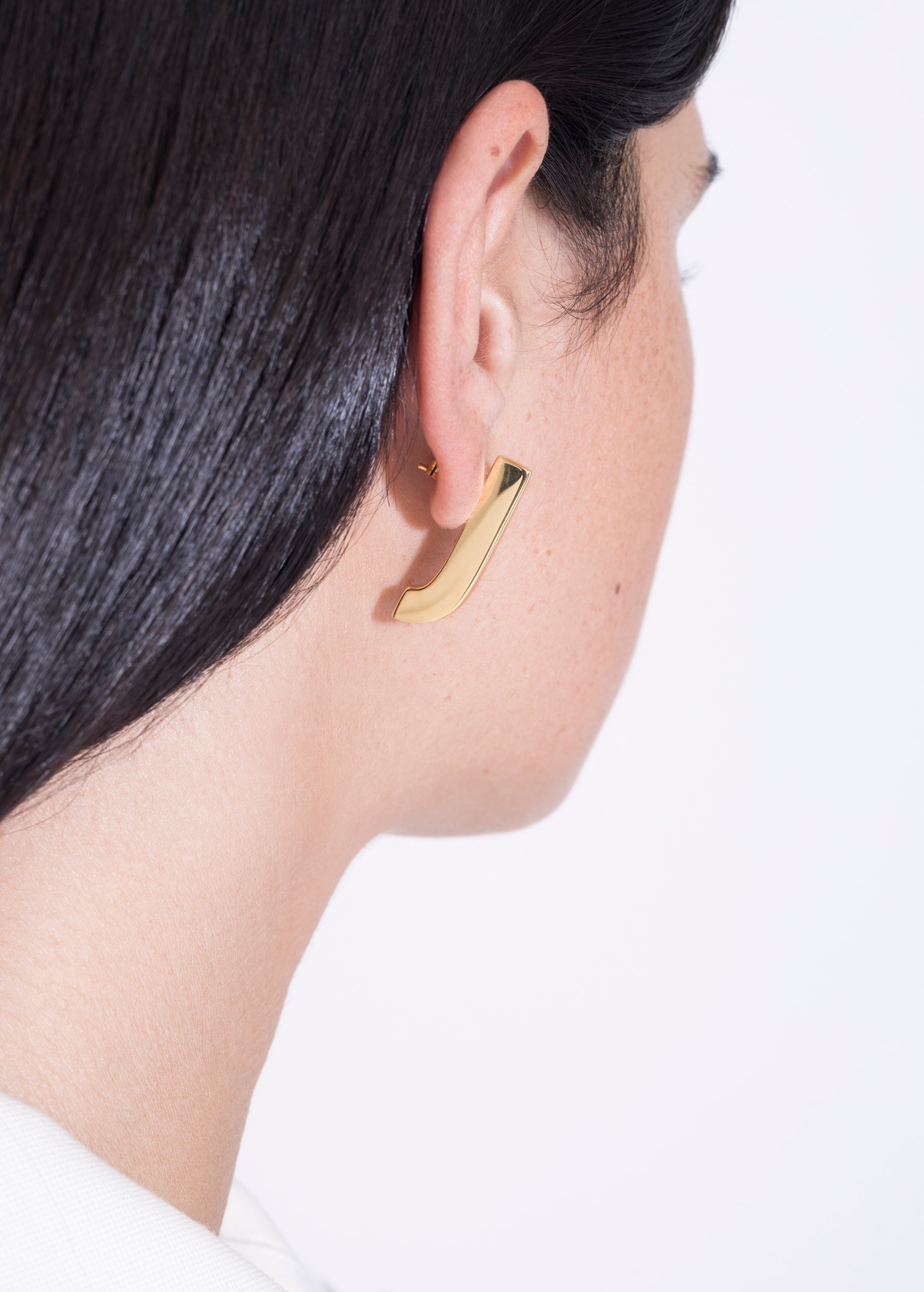 model wearing almost fiona earrings in gold