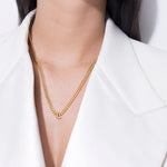 model wearing alphabet necklace with pendant L in gold
