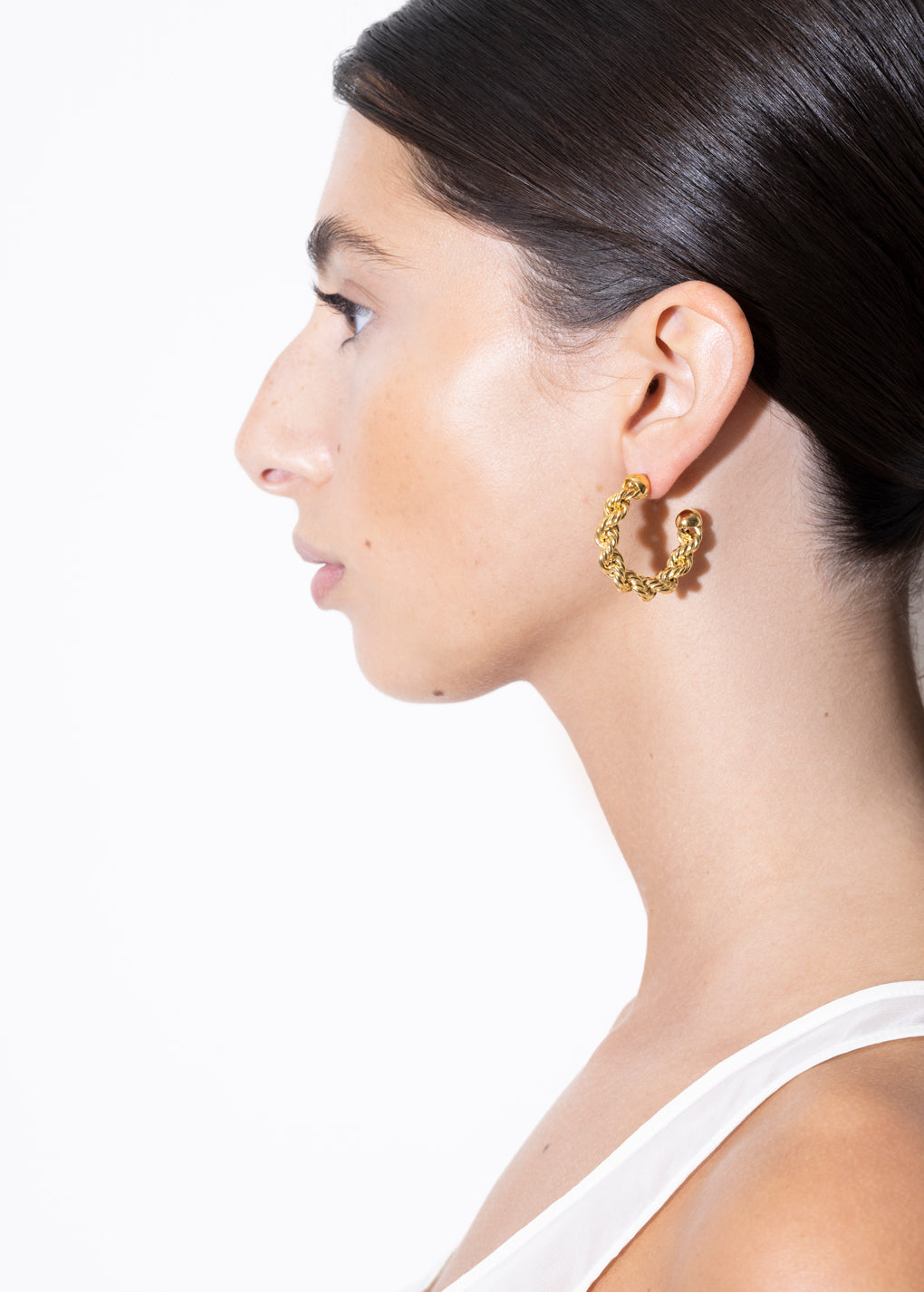 model wearing bia earrings in gold