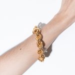 model wearing goliath bracelet in gold