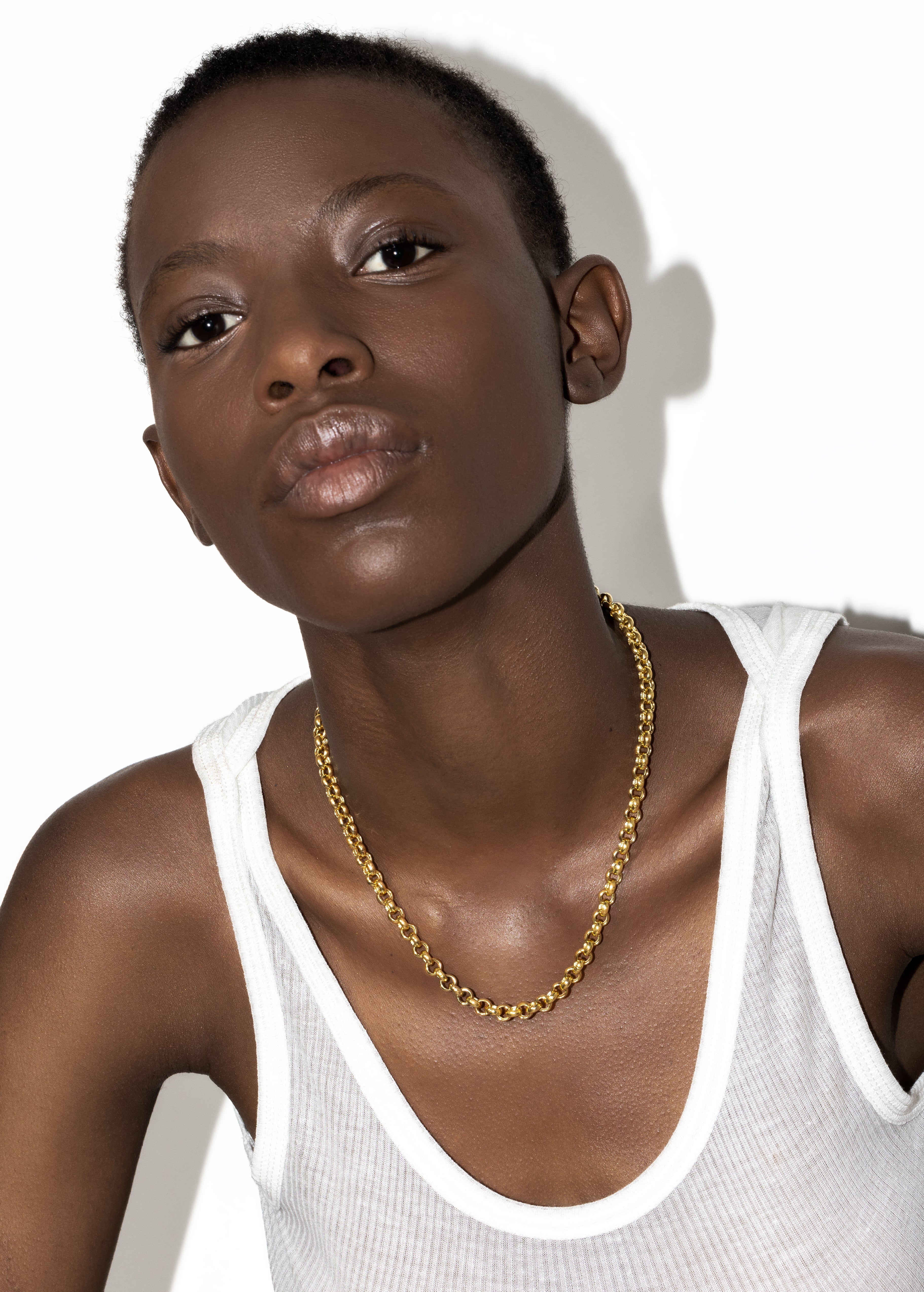 model wearing mary necklace in gold