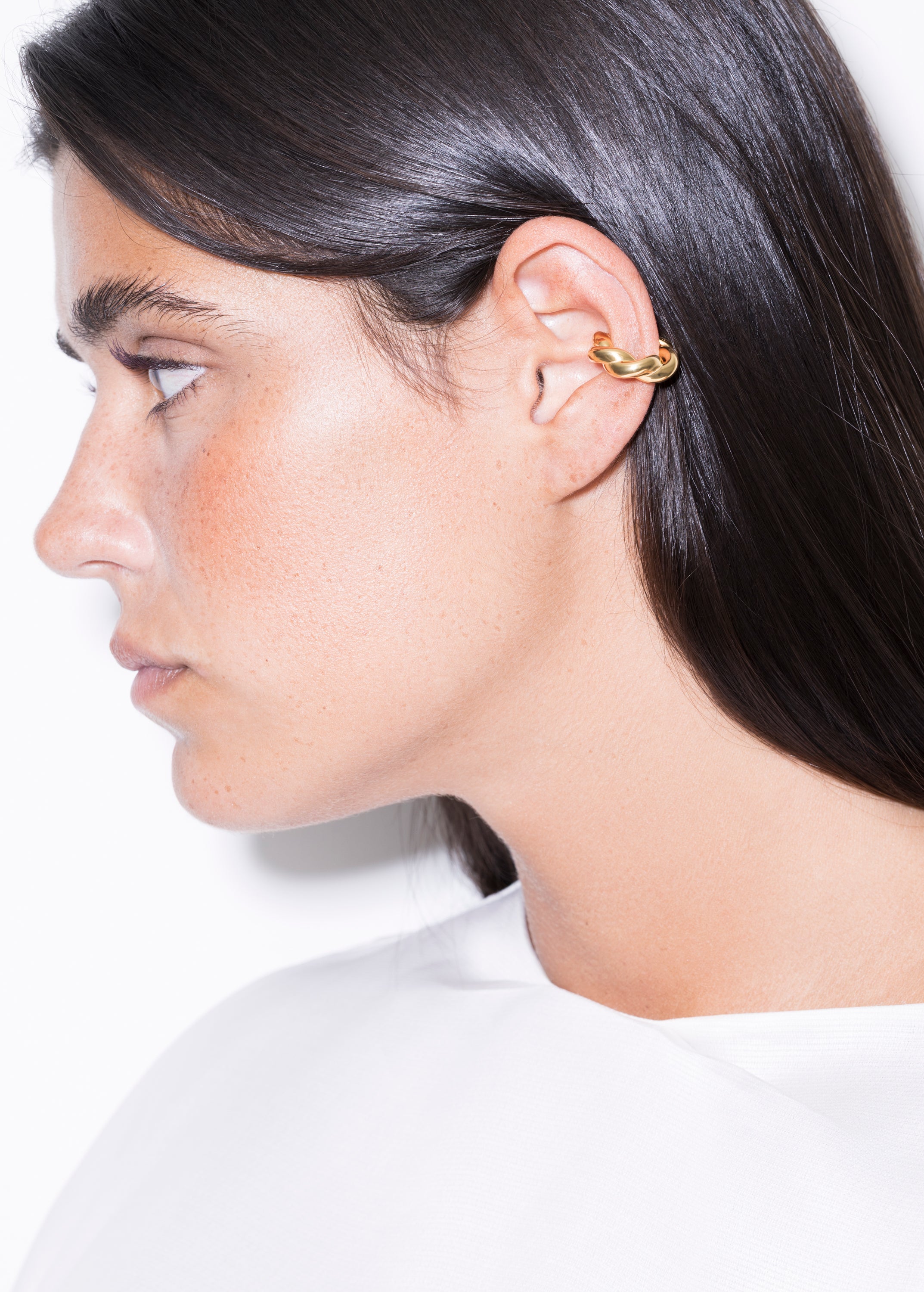 model wearing monet earcuff in gold